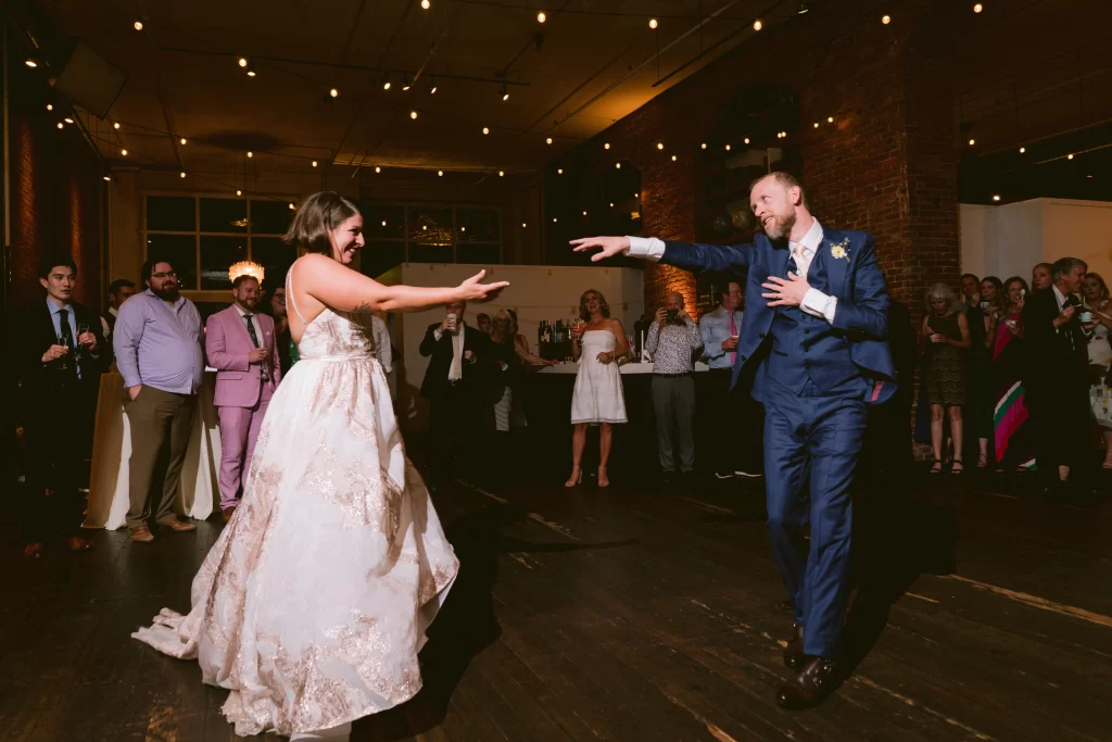 Image of a couple dancing while the wedding DJ plays their must-have songs.