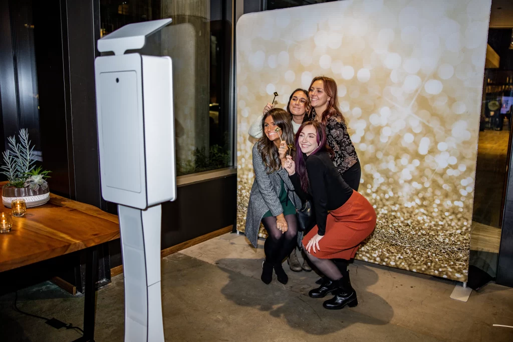 Image highlighting additional services, like the photobooth, offered by a DJ.