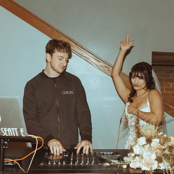 Image of a DJ creating a lasting impression at a Seattle wedding for all attendees.