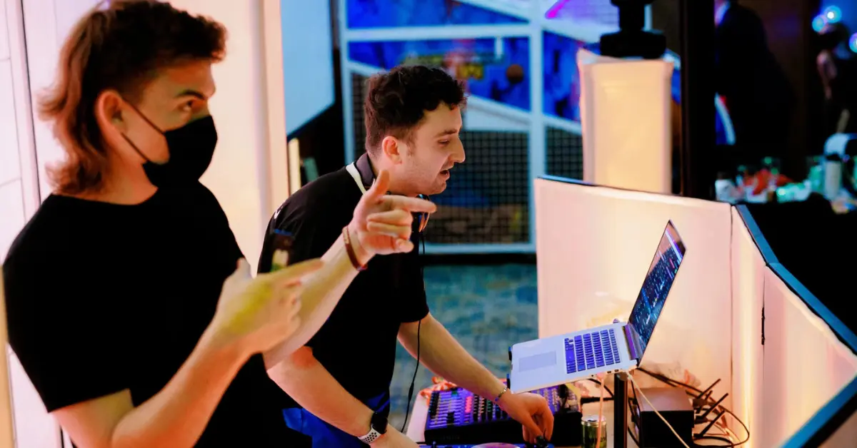 An image of Seattle, Washington DJs from Orion Entertainment standing in the DJ booth and making everyone's night better.